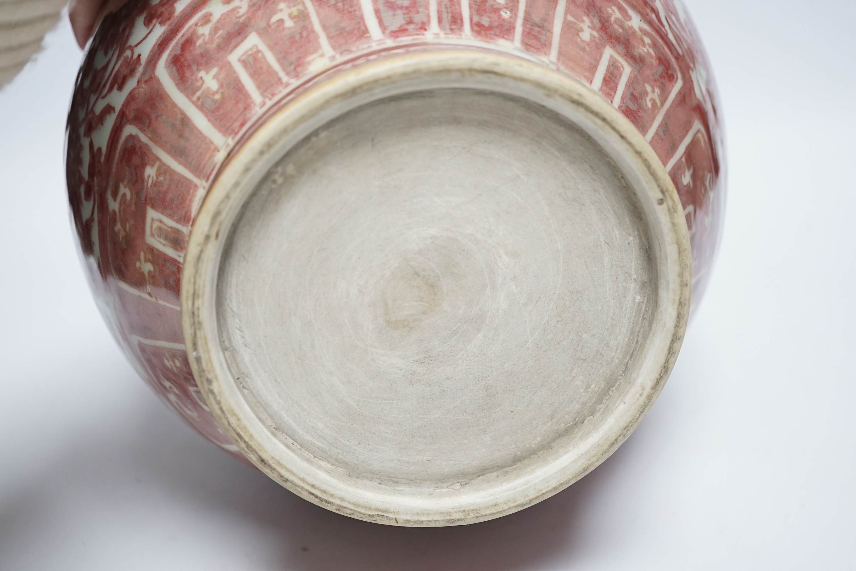 A Chinese underglaze copper red floral vase with twin handles, 27cm high